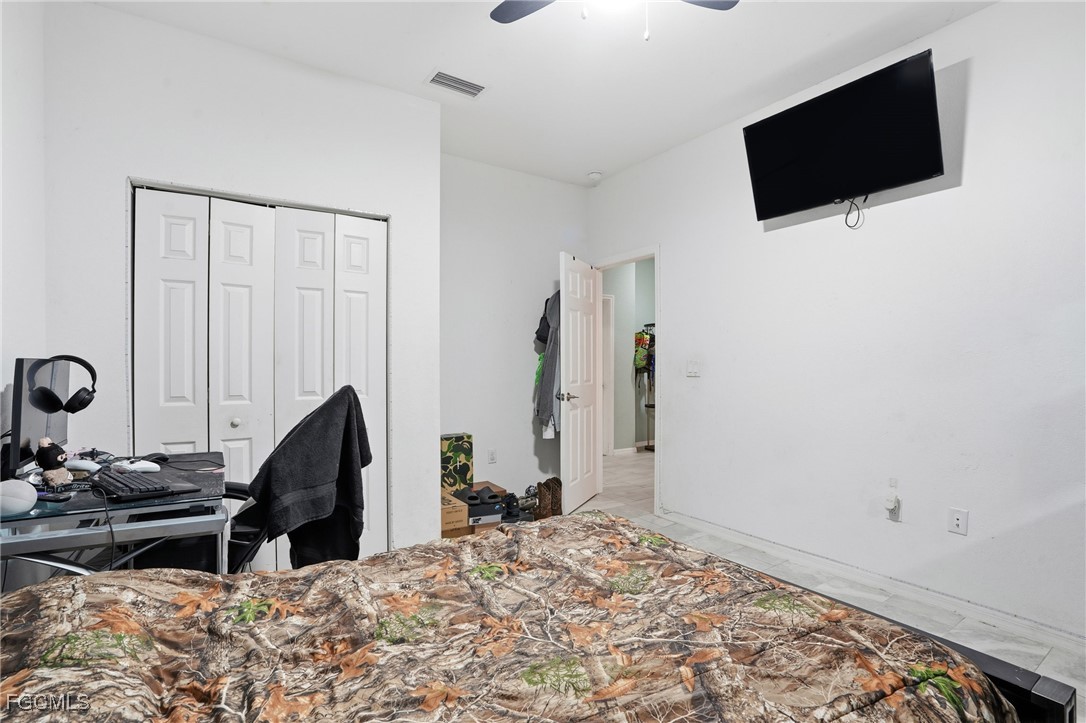 1004 Hamilton Street Immokalee, FL 34142 - Photo 29 of 45 a view of a livingroom with furniture and flat screen tv