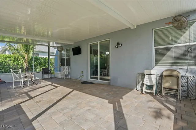 a bedroom with a bed and a chair