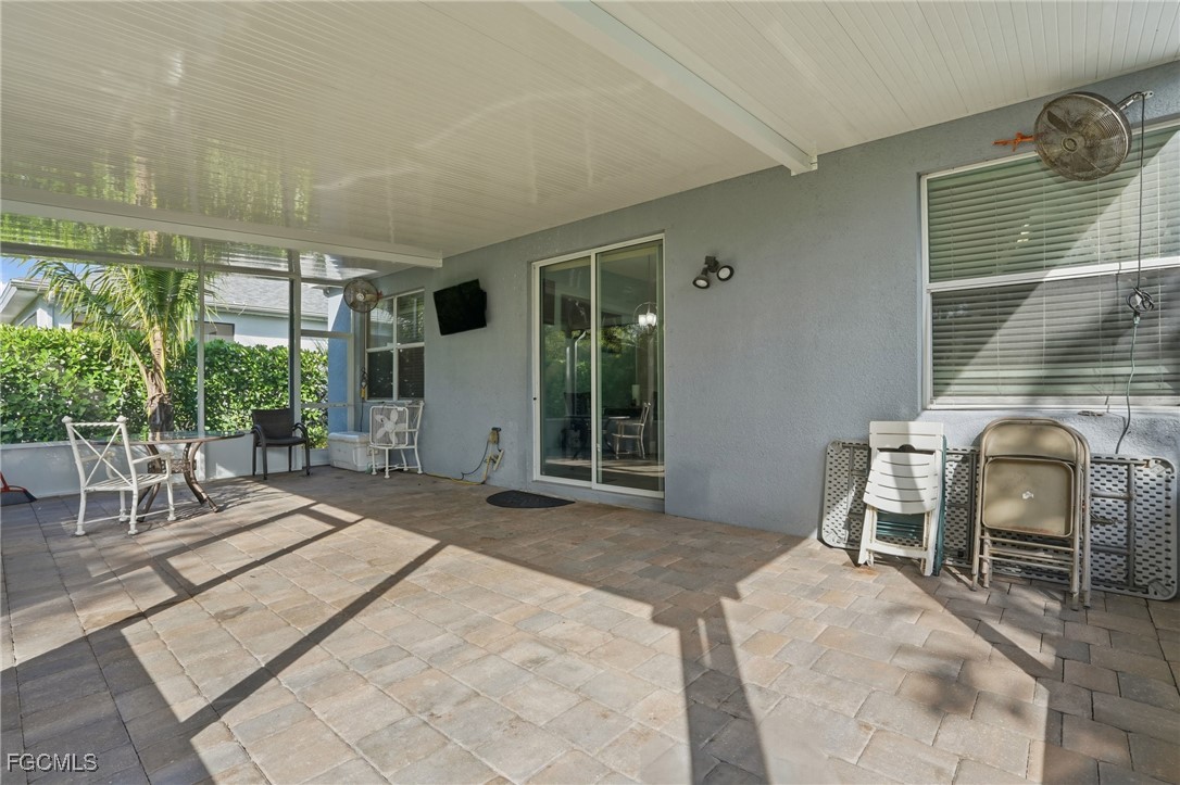 1004 Hamilton Street Immokalee, FL 34142 - Photo 33 of 45 a bedroom with a bed and a chair