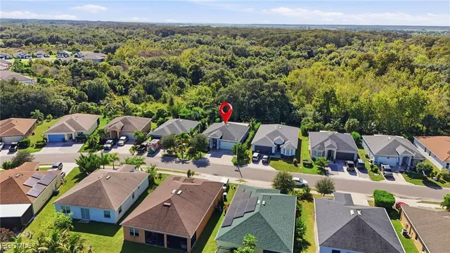 an aerial view of multiple houses with yard