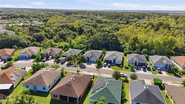 an aerial view of multiple houses with yard