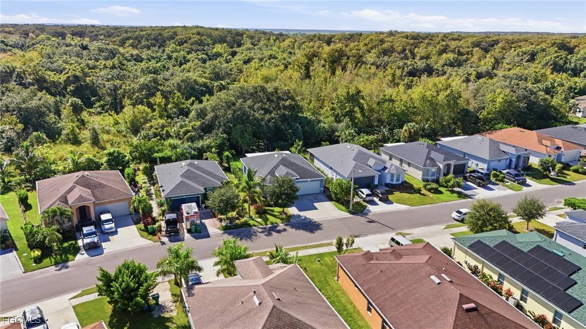 1004 Hamilton Street Immokalee, FL 34142 - Photo 40 of 45 a view of a house with a garden