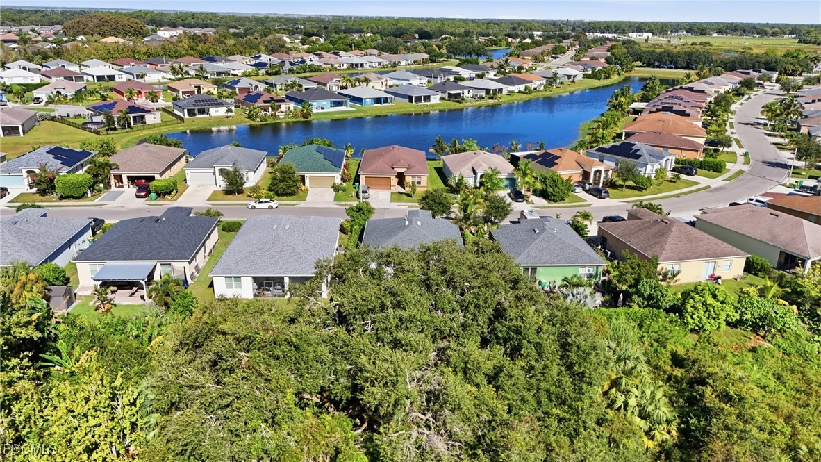 1004 Hamilton Street Immokalee, FL 34142 - Photo 42 of 45 an aerial view of residential houses with outdoor space