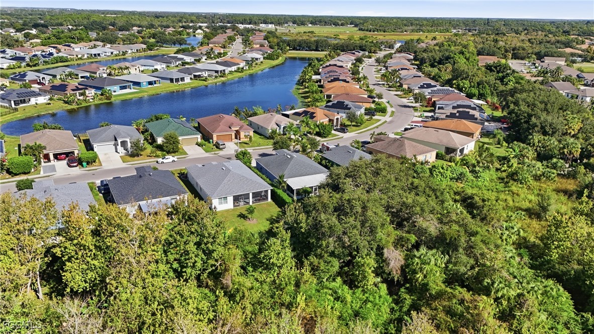 1004 Hamilton Street Immokalee, FL 34142 - Photo 43 of 45 an aerial view of residential houses with outdoor space