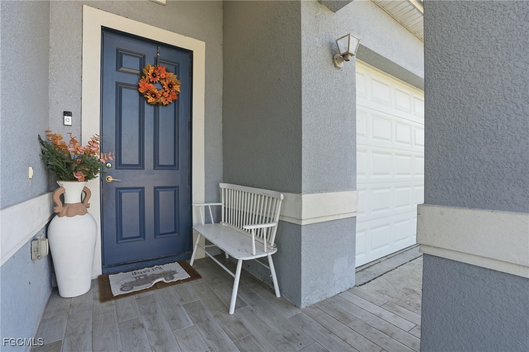 1004 Hamilton Street Immokalee, FL 34142 - Photo 5 of 45 a view of a hallway with wooden floor and a window