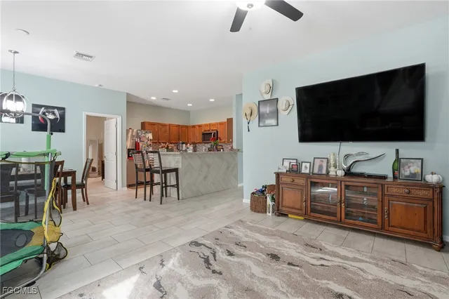 a view of a livingroom with furniture and a flat screen tv