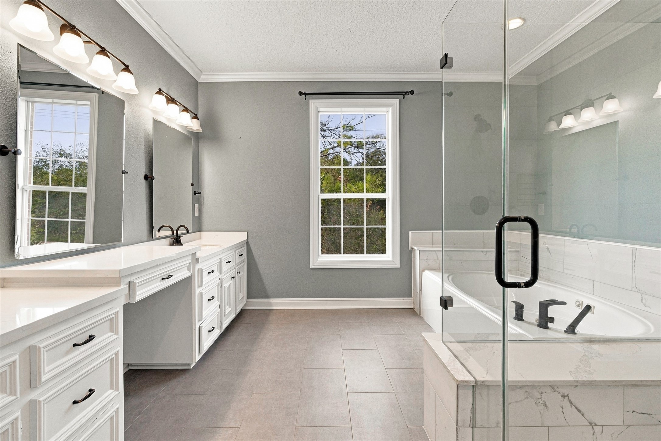 101 Rustic Lane Friendswood, TX 77546 - Photo 25 of 44 Updated primary bath upstairs with double sinks, oversized shower and jetted tub!