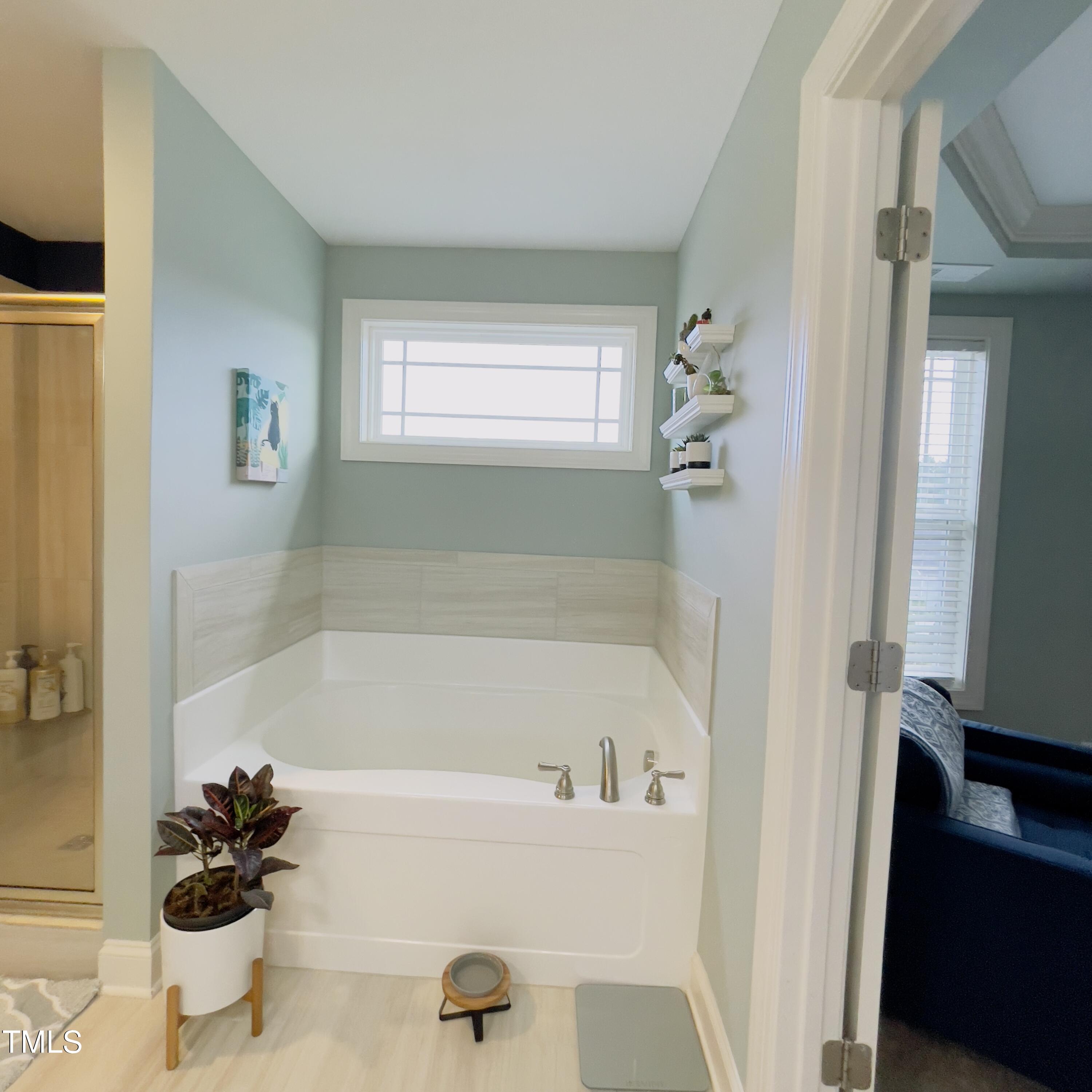 136 Unique Place Garner, NC 27529 - Photo 11 of 21 a bath room with a sink a toilet and a bathtub