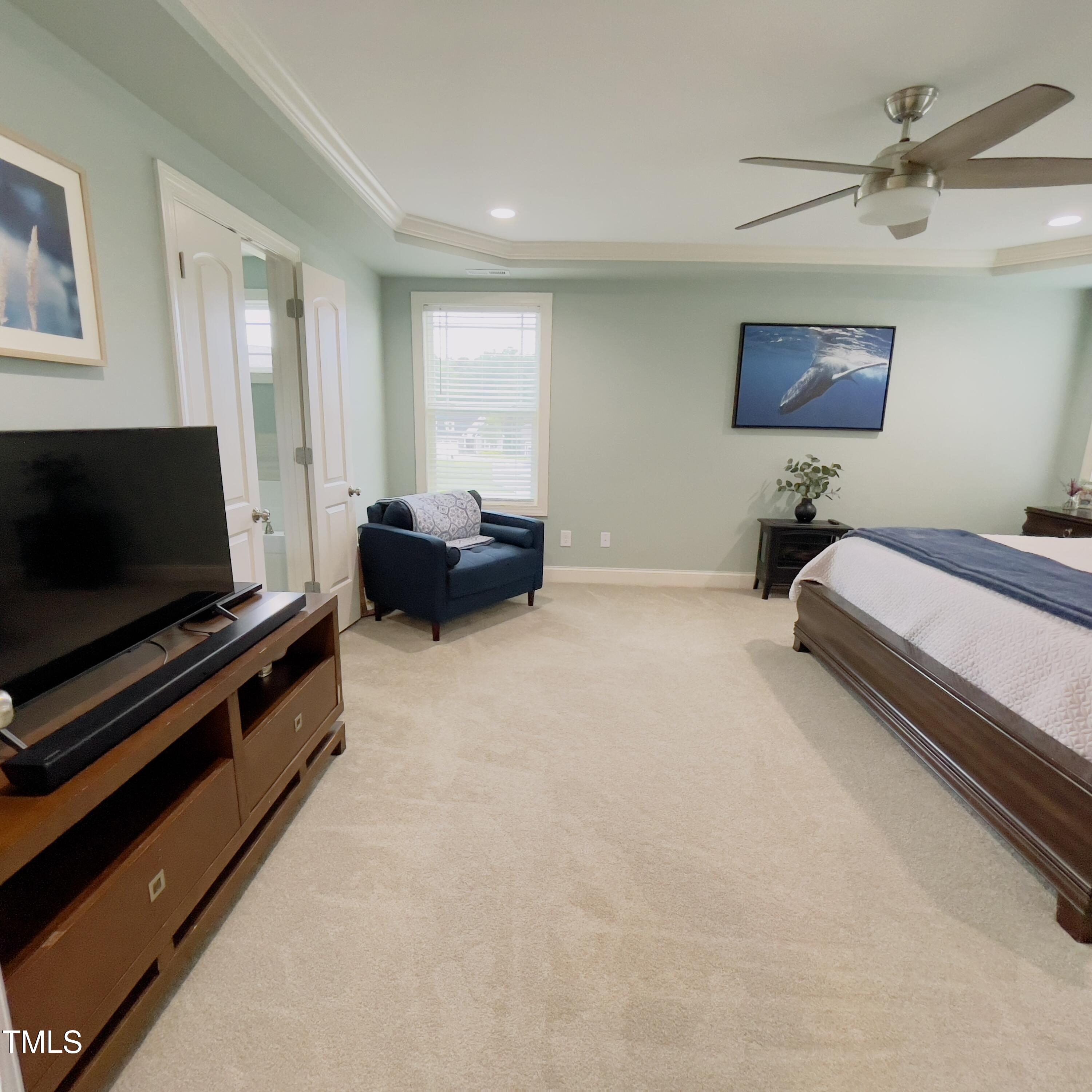 136 Unique Place Garner, NC 27529 - Photo 13 of 21 a living room with furniture and a flat screen tv