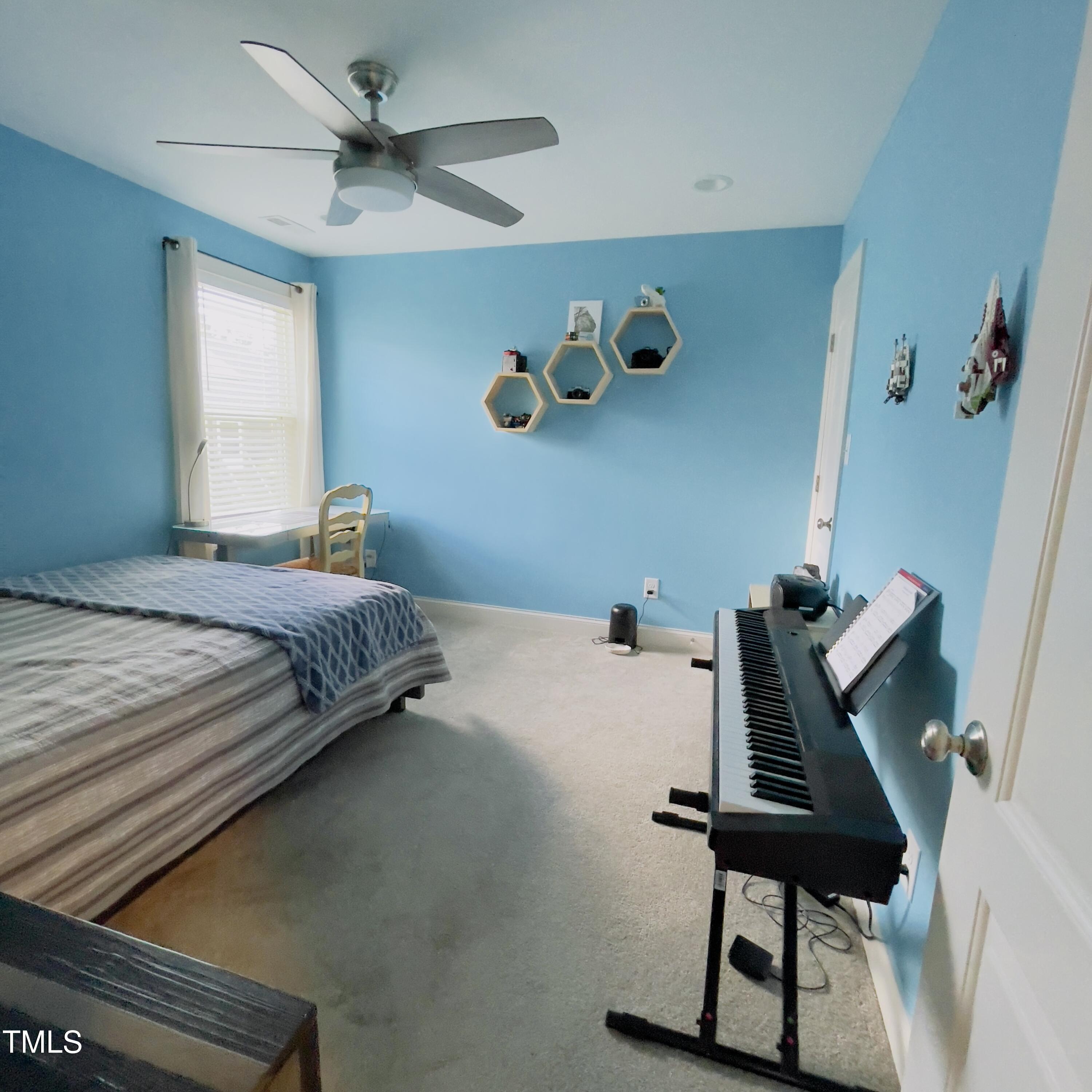 136 Unique Place Garner, NC 27529 - Photo 17 of 21 a bedroom with a bed and a desk