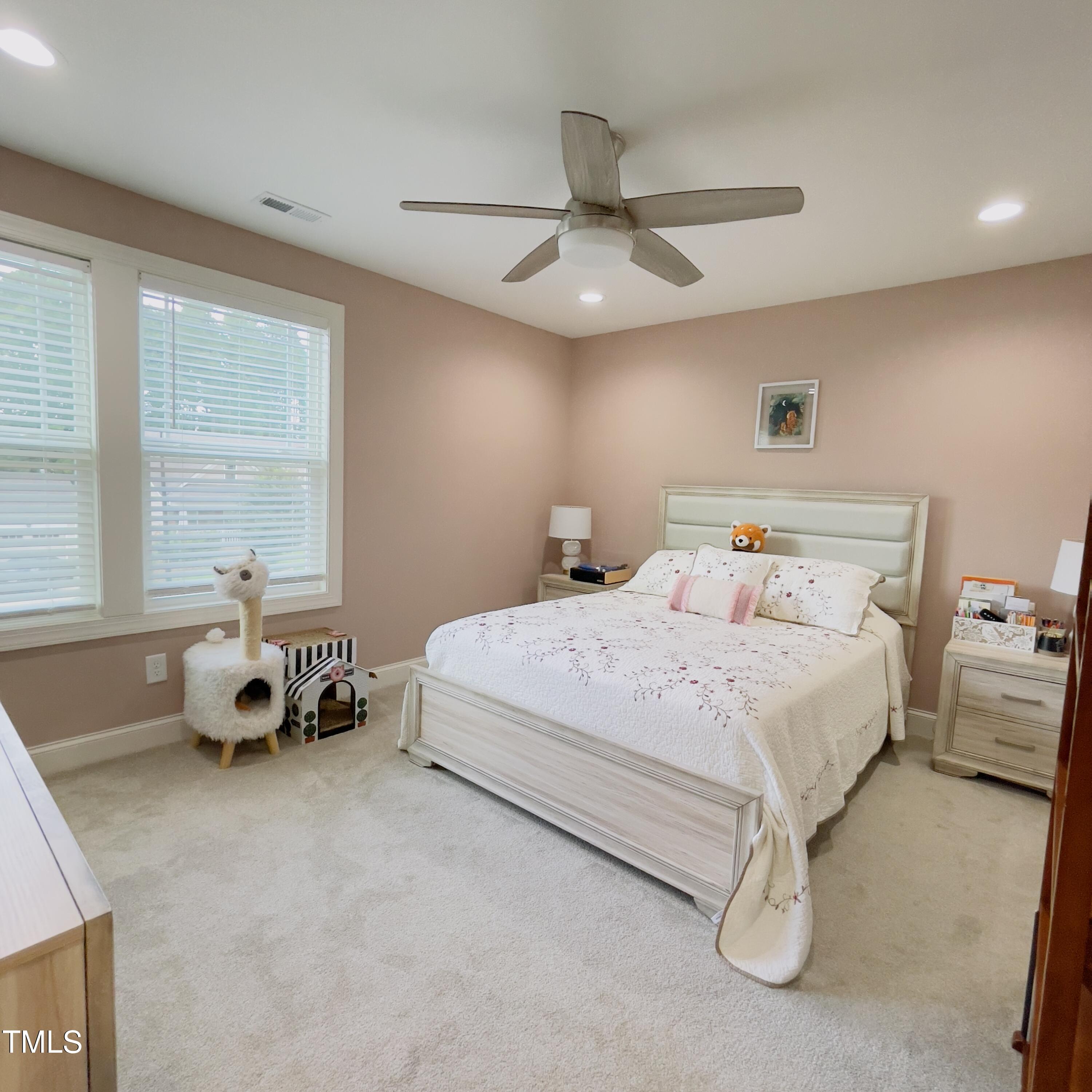 136 Unique Place Garner, NC 27529 - Photo 18 of 21 a bedroom with a bed and window