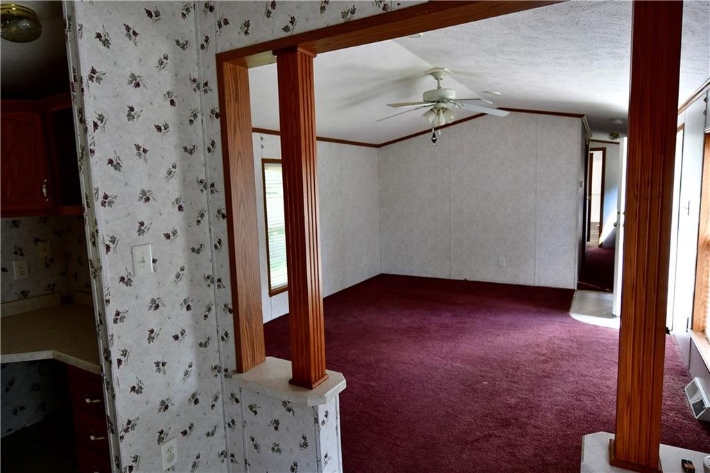 604 Deana Way Rochester, PA 15074 - Photo 9 of 22 a view of a hallway with wooden floor and staircase