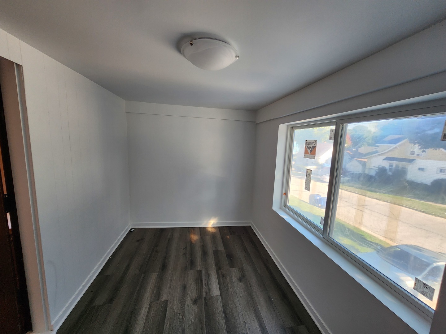 600 Sunderlin Street Waukegan, IL 60085 - Photo 3 of 12 a view of wooden floor in an empty room
