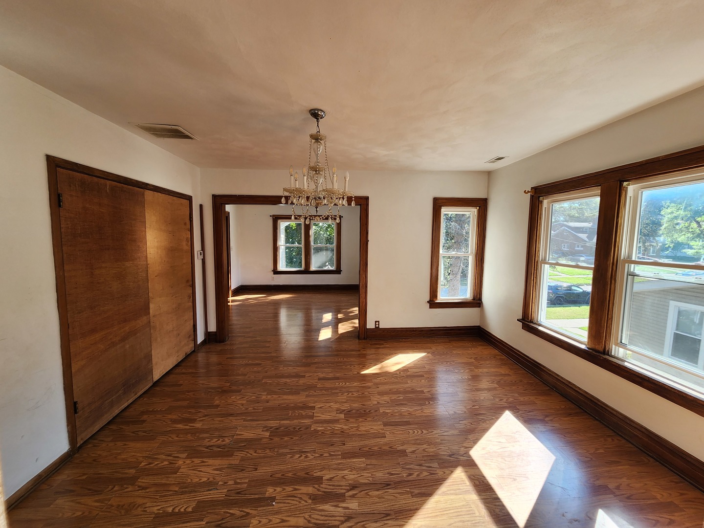 600 Sunderlin Street Waukegan, IL 60085 - Photo 4 of 12 a view of an empty room with window and wooden floor