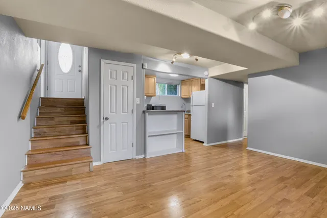a view of a kitchen cabinets and wooden floor