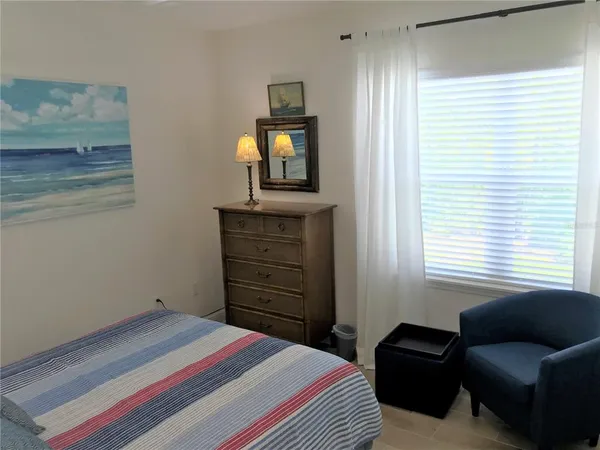 a bedroom with a bed and furniture