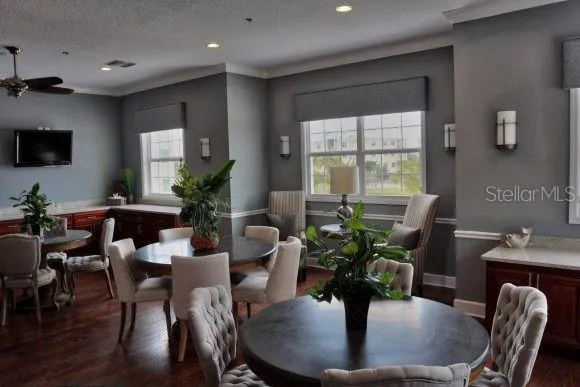 a view of a dining room with furniture window and wooden floor