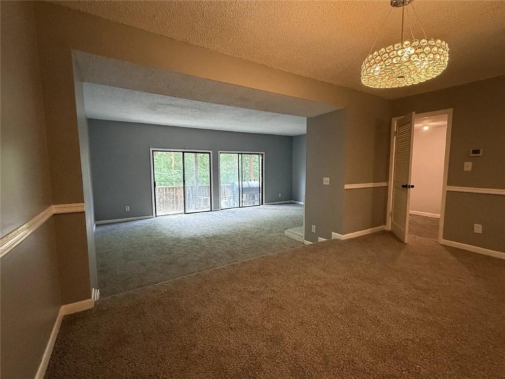 20 Quail Run Decatur, GA 30035 - Photo 2 of 15 a view of an empty room with a chandelier fan