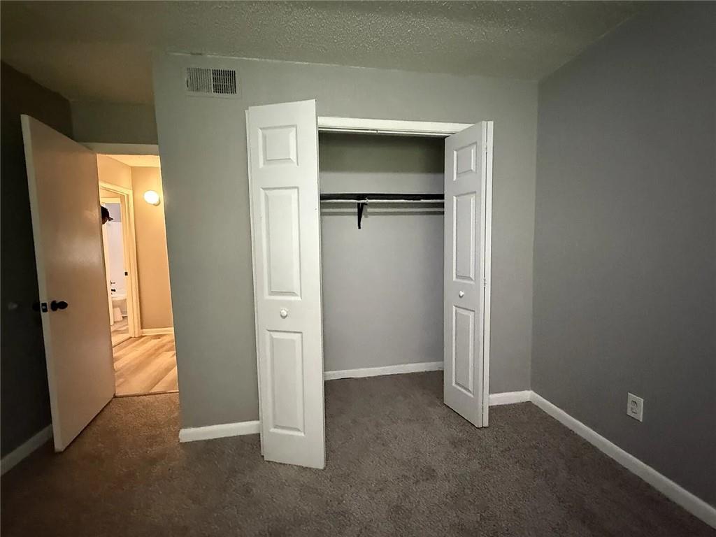 20 Quail Run Decatur, GA 30035 - Photo 8 of 15 an empty room with closet and wooden floor