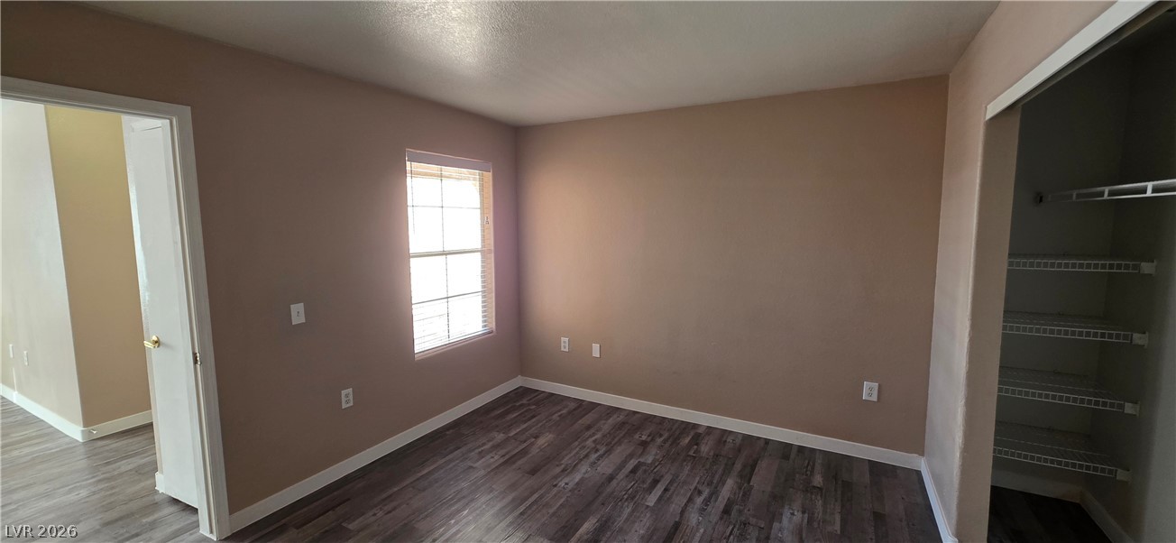 1830 North Pecos Road, Unit 142 Las Vegas, NV 89115 - Photo 17 of 19 Well-maintained room with hard surface flooring and a convenient closet, perfect for a cozy living space.