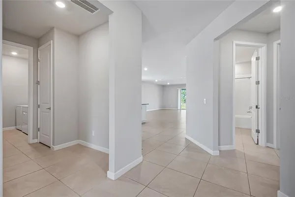 wooden floor with white walls