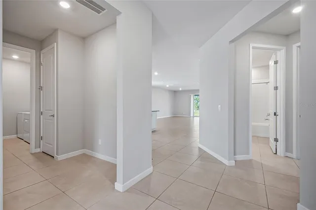 wooden floor with white walls
