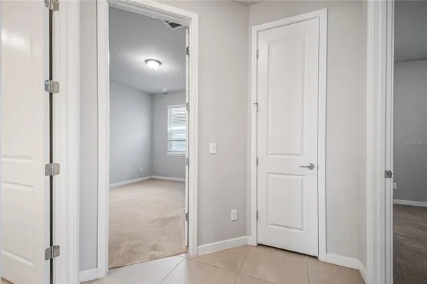 an empty room that has a bathroom in it