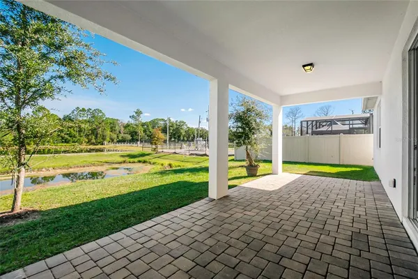 a view of a swimming pool with an outdoor seating