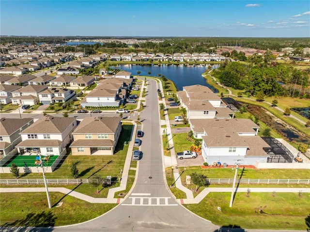 an aerial view of residential houses with outdoor space