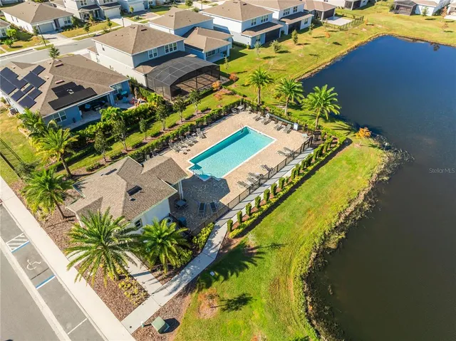an aerial view of a house with a ocean view