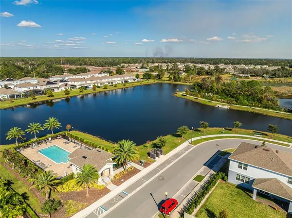 an aerial view of a house with a swimming pool