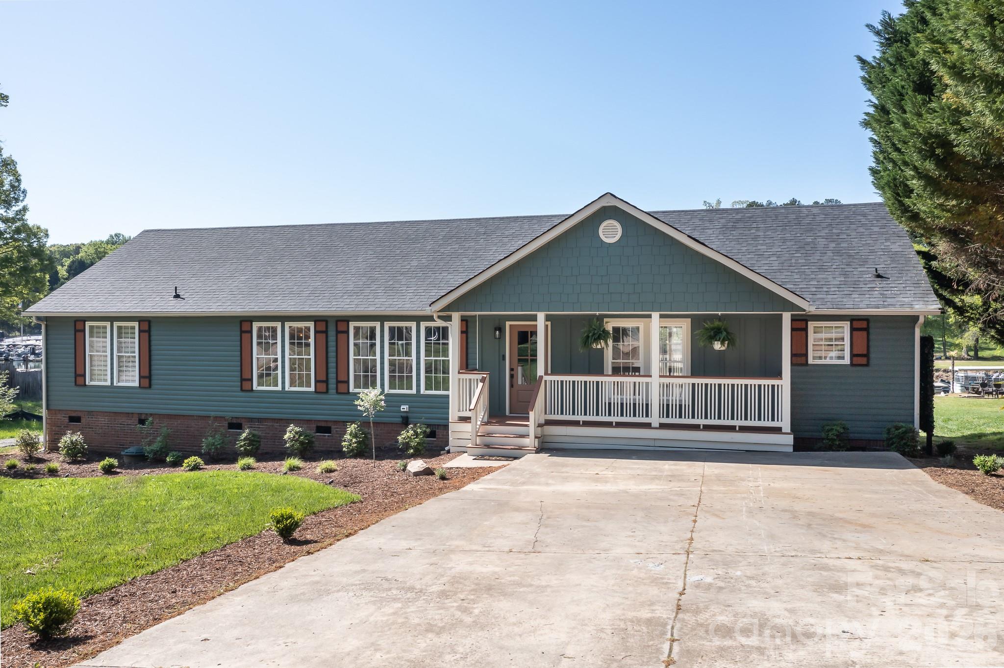 7858 Blackwood Road Denver, NC 28037 - Photo 1 of 11 a front view of a house with a yard