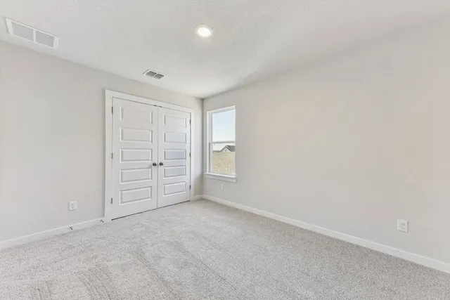 an empty room with a bathroom