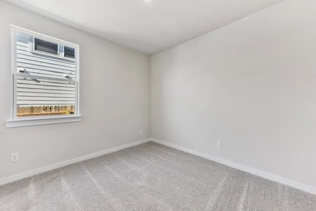 a view of a hallway with wooden floor and entryway