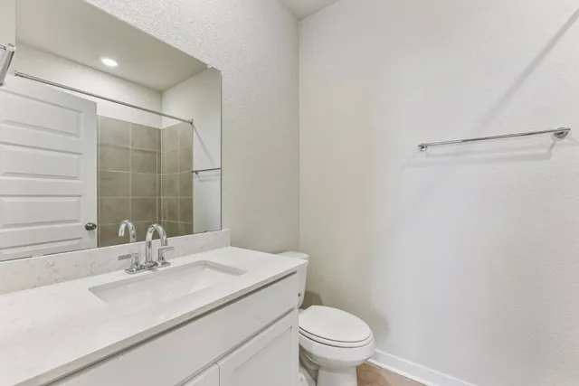 a sign board with a street sign on the side of the road