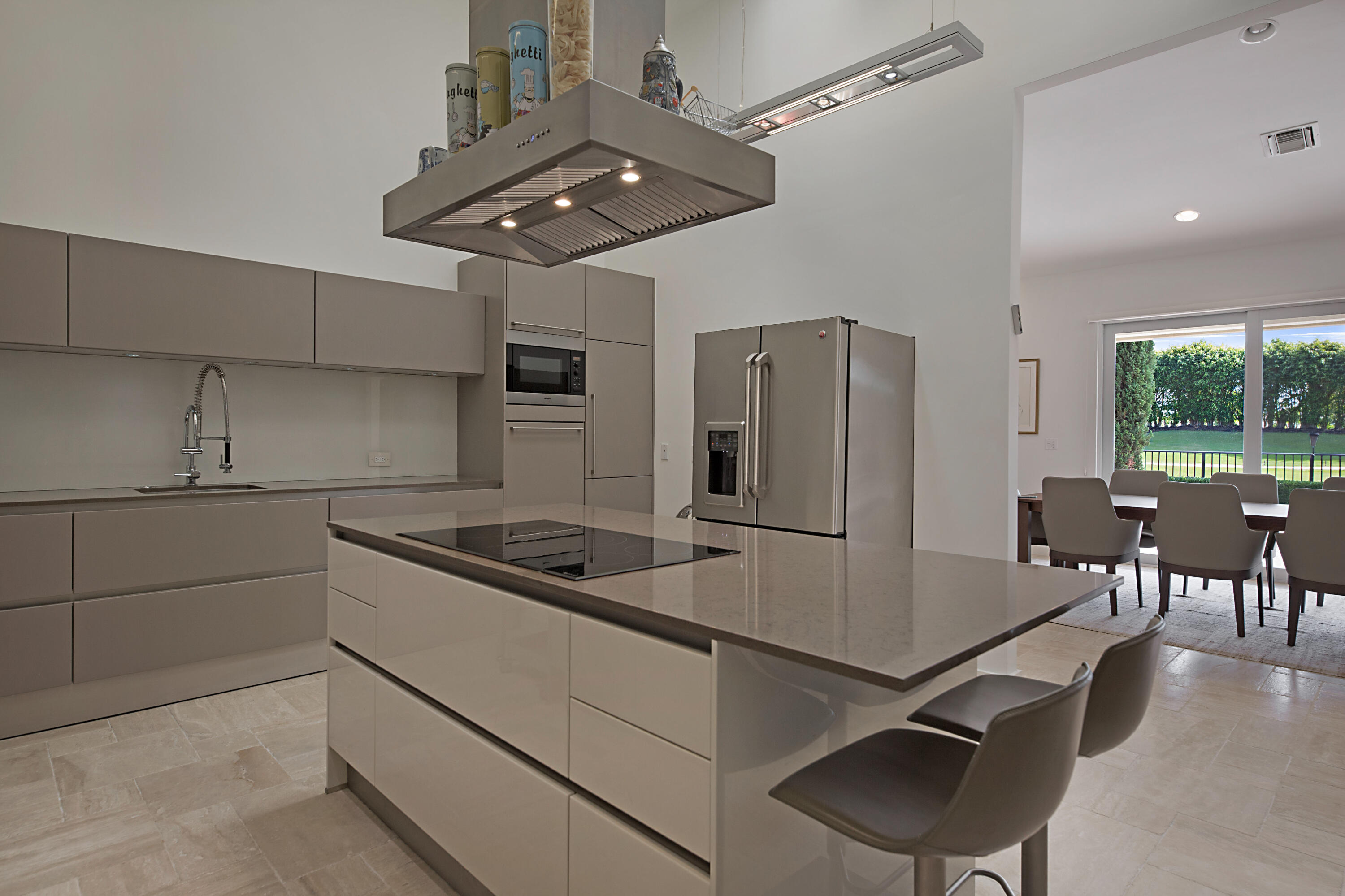7316 Mandarin Drive Boca Raton, FL 33433 - Photo 15 of 45 a kitchen with stainless steel appliances granite countertop a sink a stove and a refrigerator