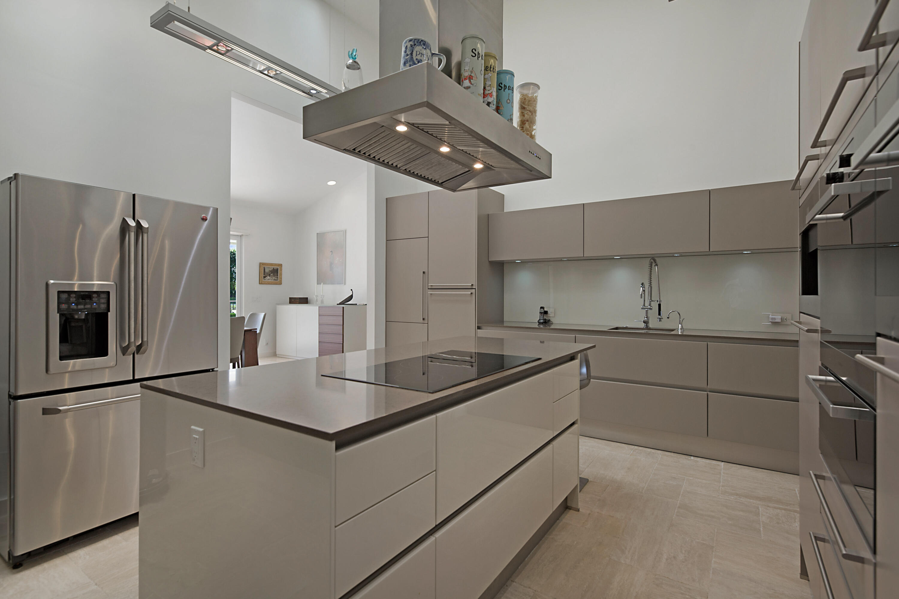 7316 Mandarin Drive Boca Raton, FL 33433 - Photo 18 of 45 a kitchen with stainless steel appliances granite countertop a sink stove and refrigerator