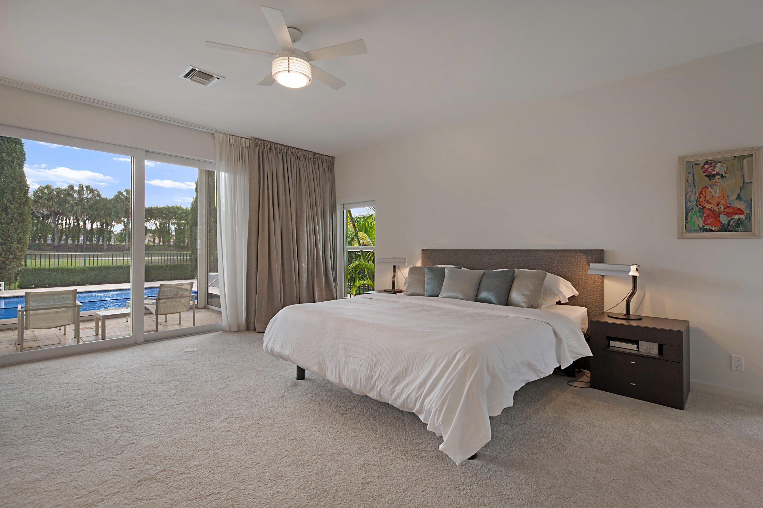 7316 Mandarin Drive Boca Raton, FL 33433 - Photo 20 of 45 a spacious bedroom with a bed and a large window