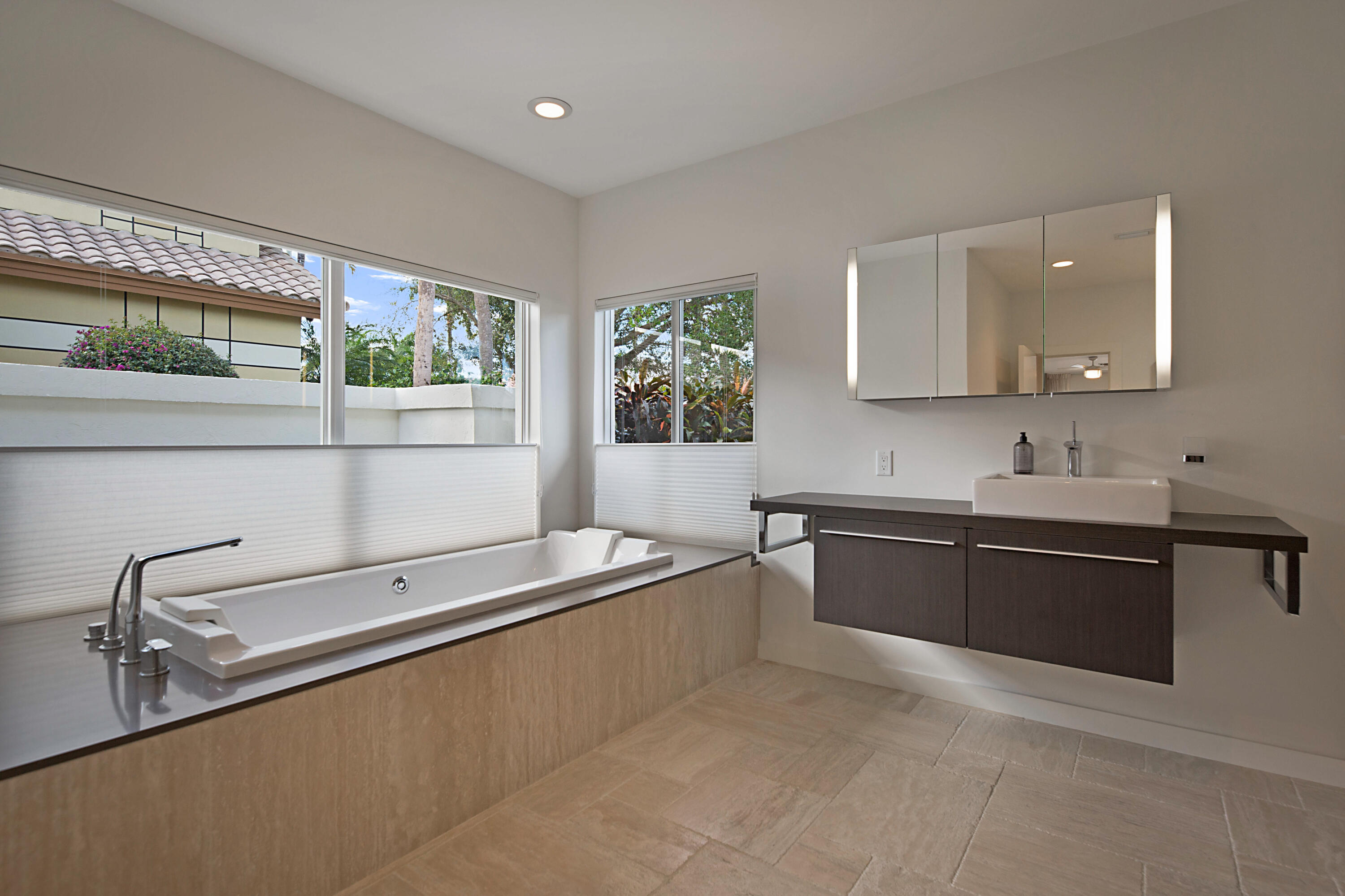 7316 Mandarin Drive Boca Raton, FL 33433 - Photo 22 of 45 a large white kitchen with a large window