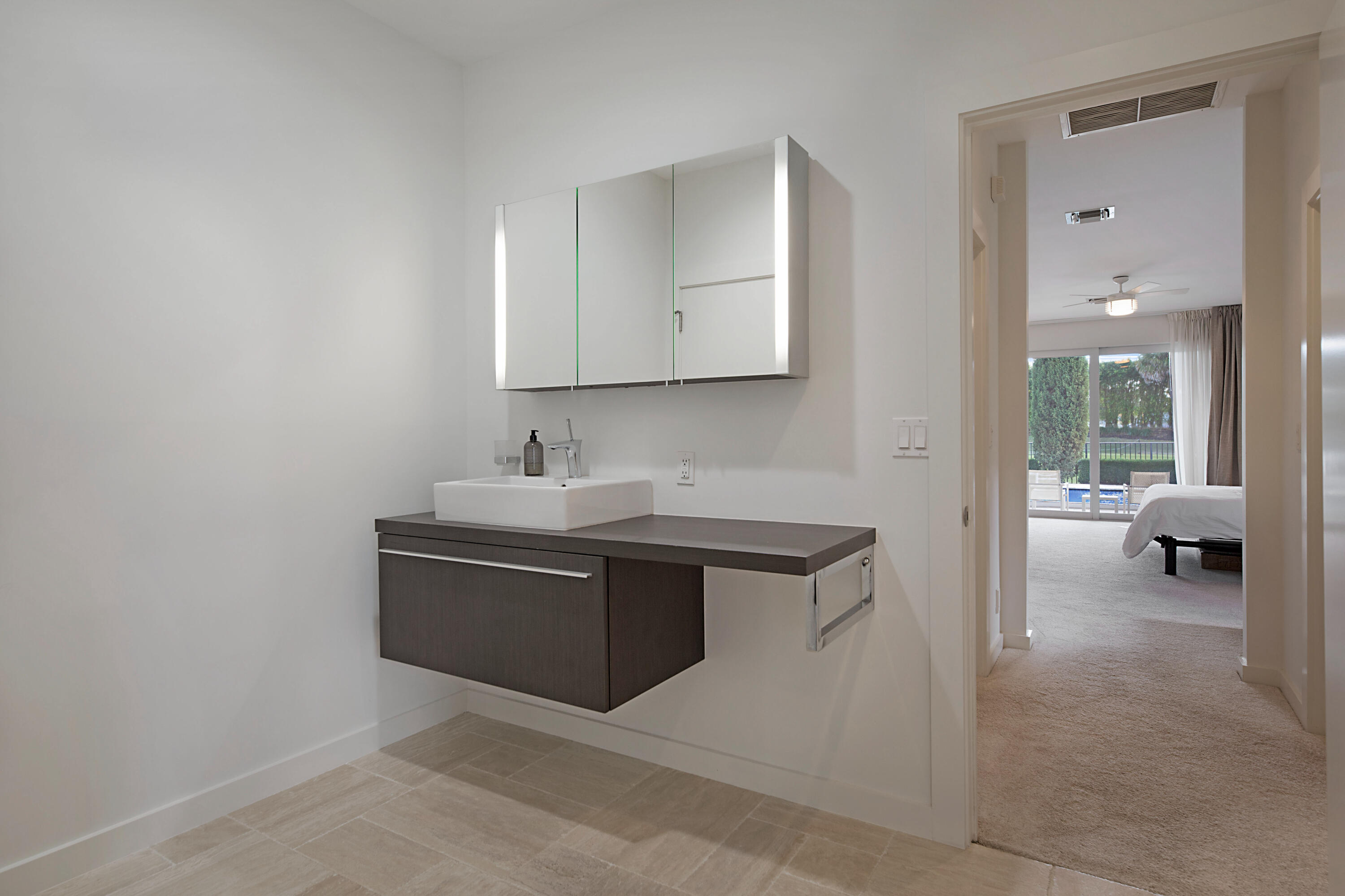 7316 Mandarin Drive Boca Raton, FL 33433 - Photo 24 of 45 a room with a sink and a mirror