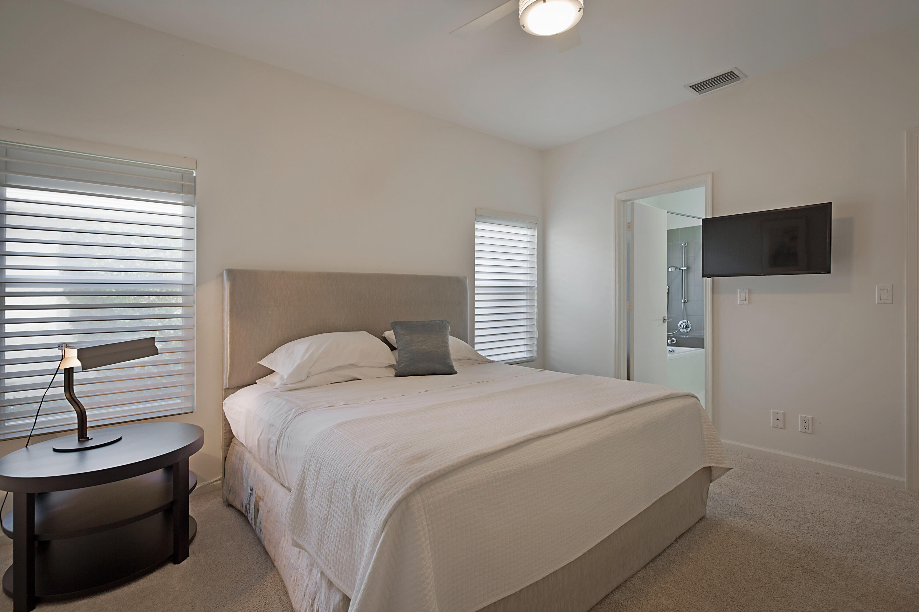 7316 Mandarin Drive Boca Raton, FL 33433 - Photo 25 of 45 a bedroom with a bed and a flat screen tv