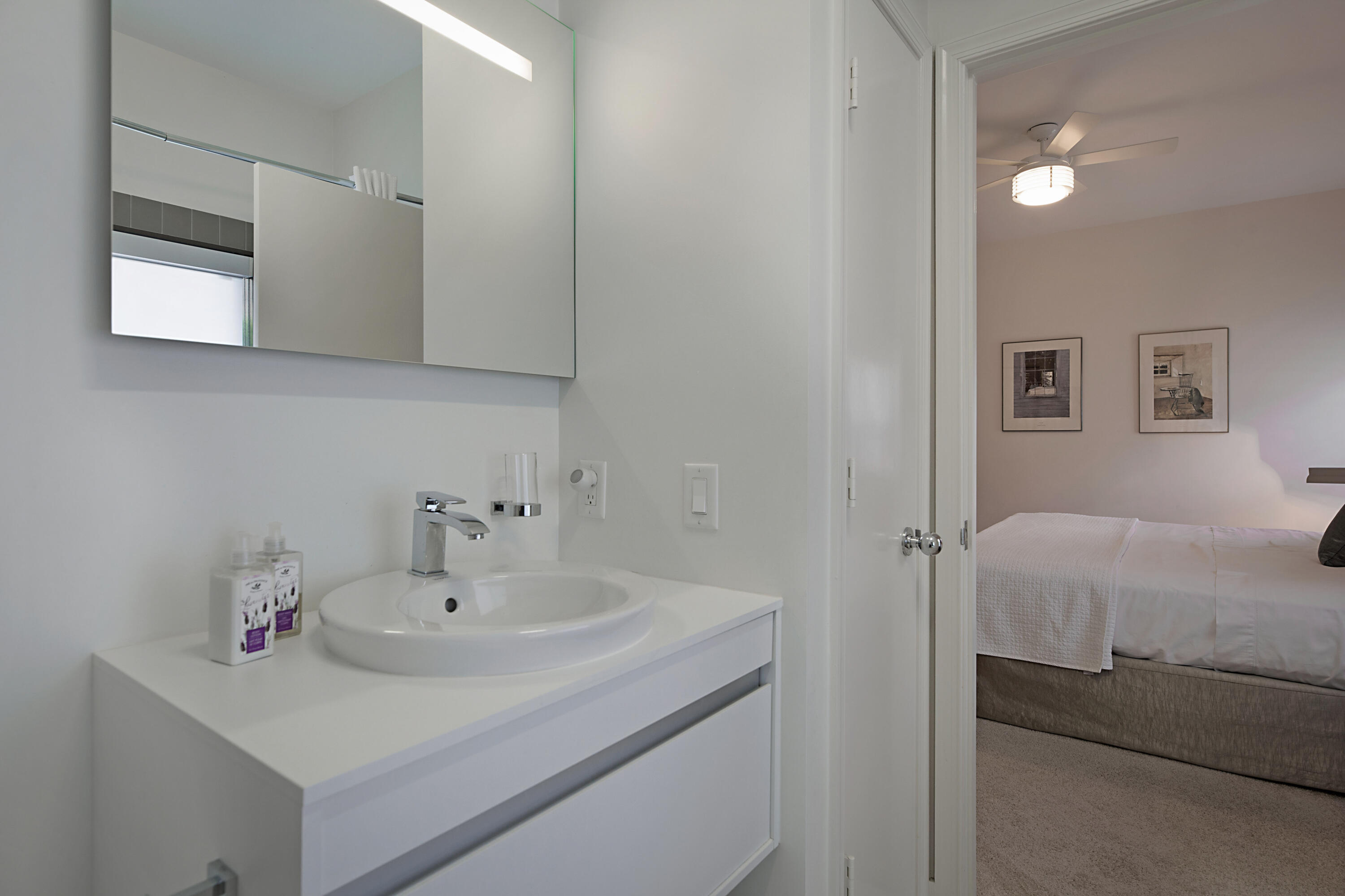 7316 Mandarin Drive Boca Raton, FL 33433 - Photo 26 of 45 a bathroom with a sink and a mirror