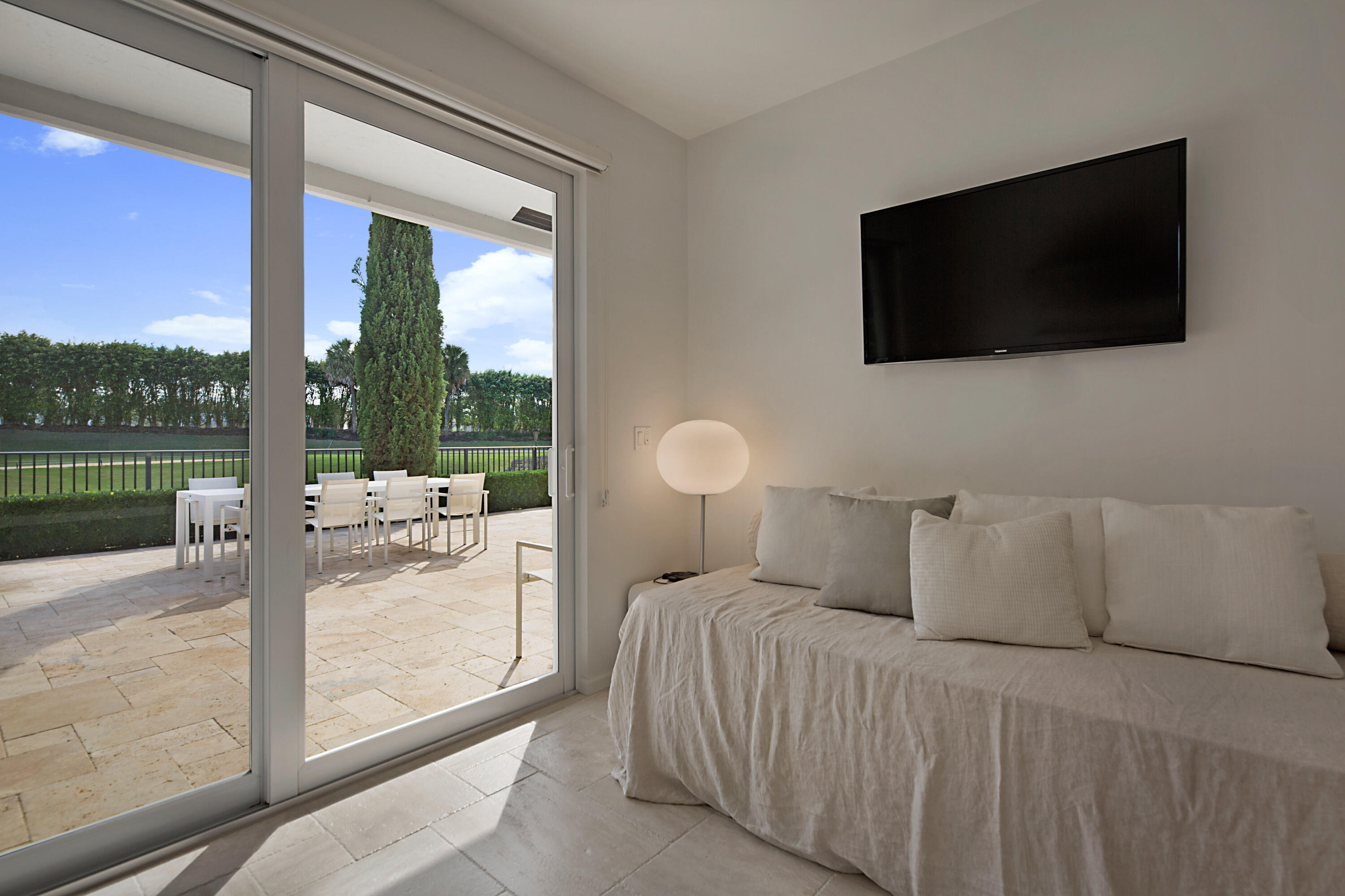 7316 Mandarin Drive Boca Raton, FL 33433 - Photo 29 of 45 a bedroom with a bed and a flat screen tv