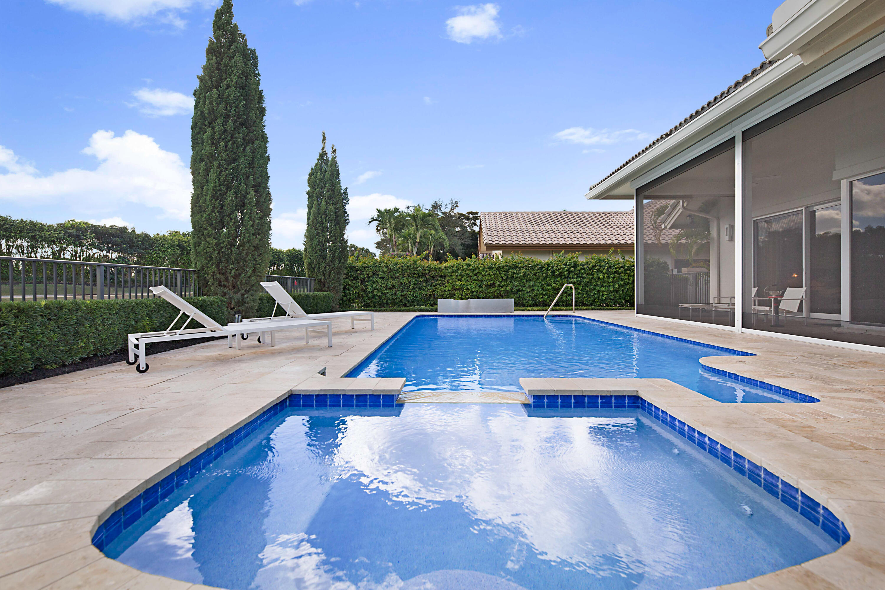 7316 Mandarin Drive Boca Raton, FL 33433 - Photo 31 of 45 a view of a swimming pool with a lounge chairs