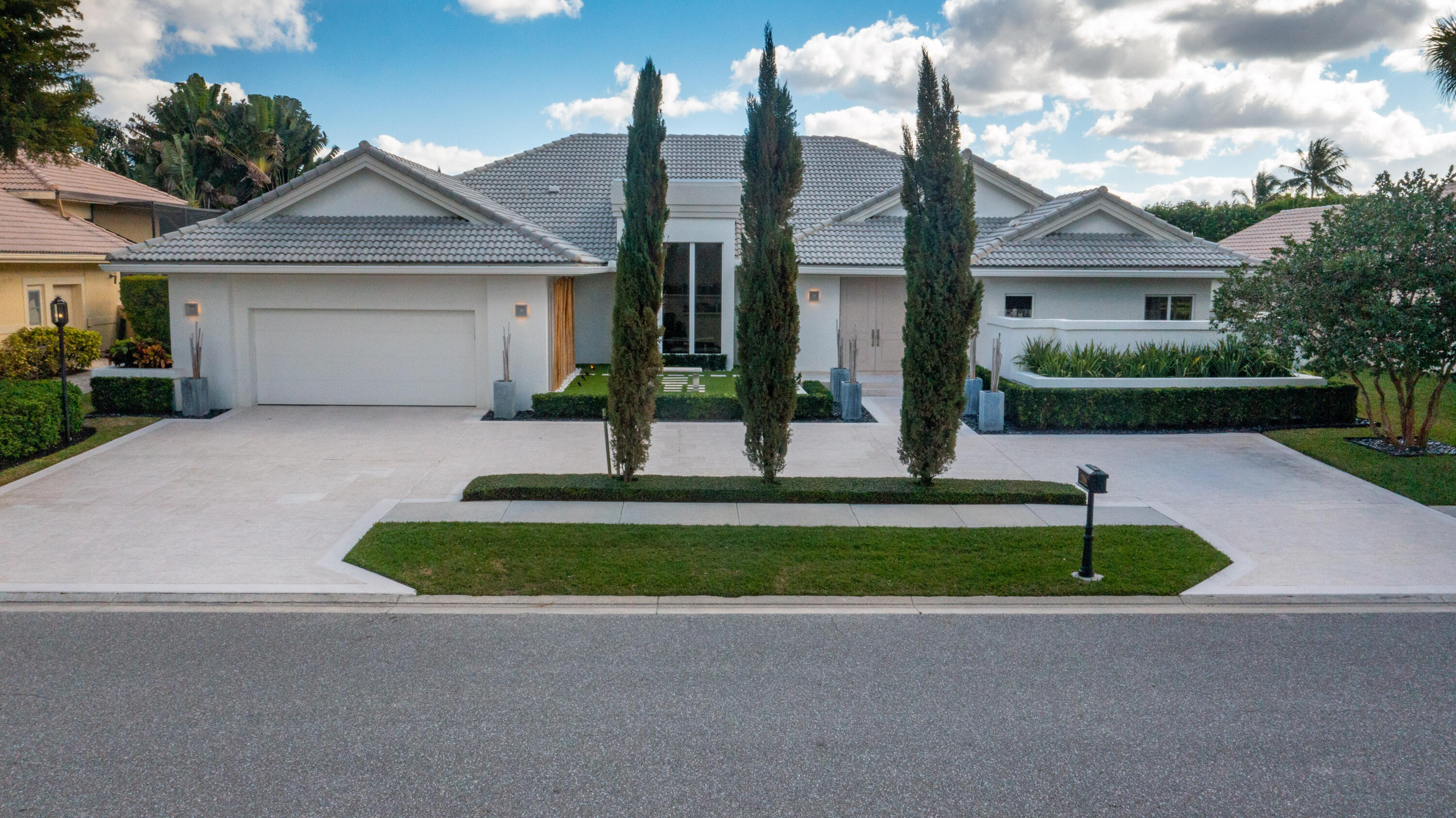 7316 Mandarin Drive Boca Raton, FL 33433 - Photo 4 of 45 a front view of a house with a yard and garage