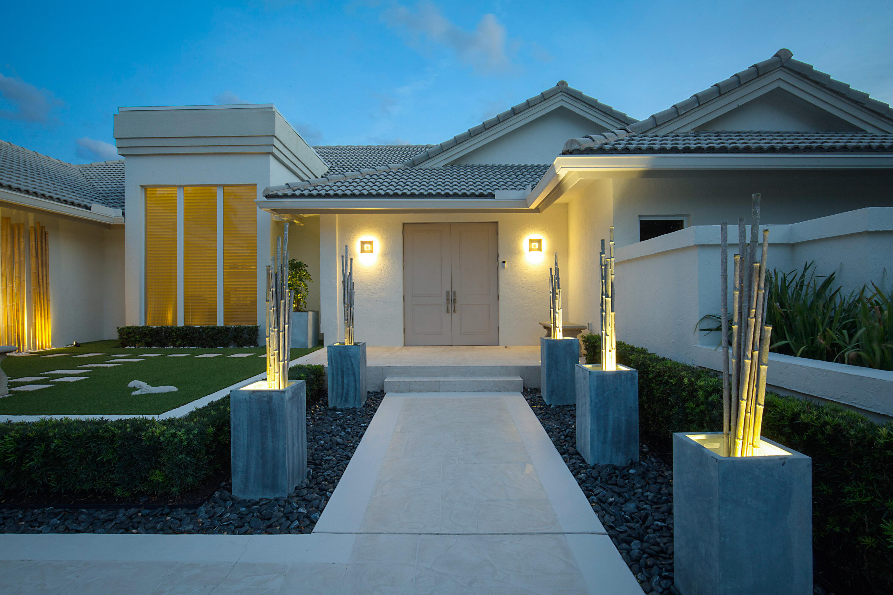 7316 Mandarin Drive Boca Raton, FL 33433 - Photo 5 of 45 a front view of a house with garden