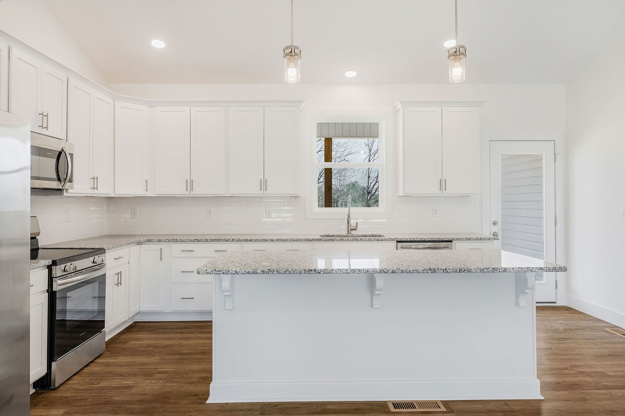 172 Johnson Chapel Road Sparta, TN 38583 - Photo 12 of 38 a kitchen with stainless steel appliances granite countertop a sink and a stove