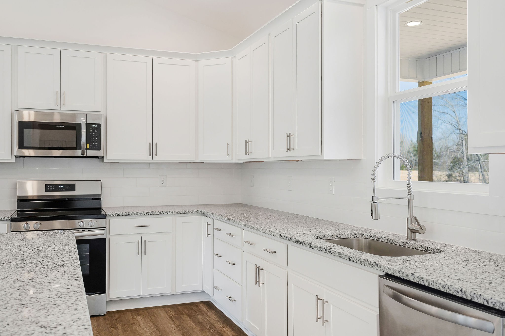 172 Johnson Chapel Road Sparta, TN 38583 - Photo 13 of 38 a kitchen with granite countertop white cabinets and a sink
