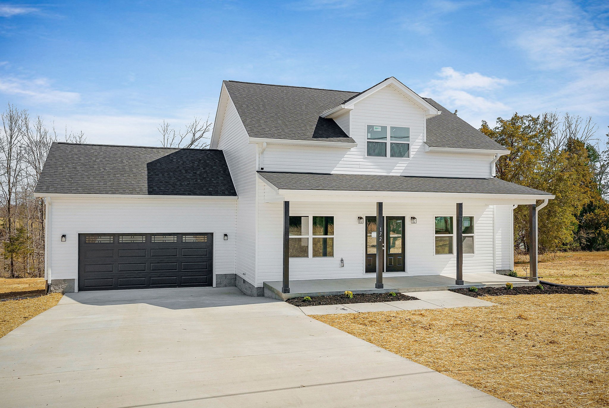 172 Johnson Chapel Road Sparta, TN 38583 - Photo 2 of 38 a front view of a house with yard and garage