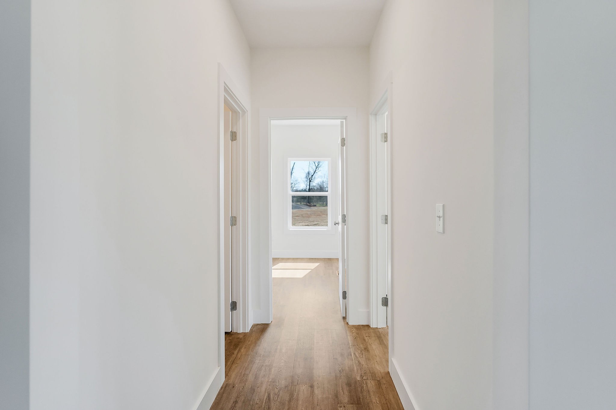 172 Johnson Chapel Road Sparta, TN 38583 - Photo 26 of 38 a view of a hallway with wooden floor and a bathroom